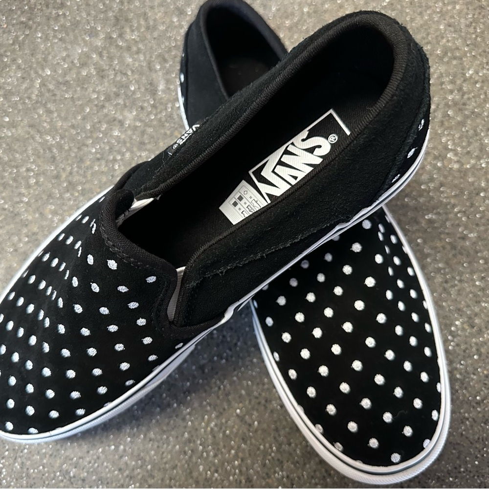 Vans~Black with white polka dots. Slip ons, Size 9 in women.